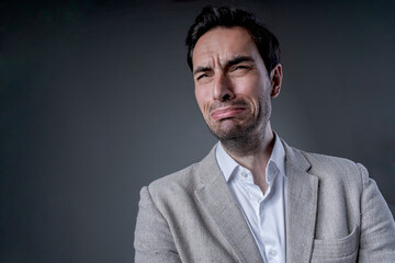 Obraz premium Handsome corporate businessman wit a sad look