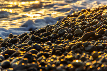 Large and small  stones on the beach. Sea pebbles  nature and abstract  bokeh background. Selective focus