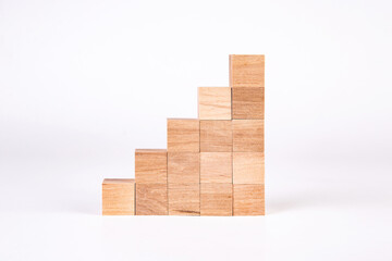 Wooden cubes in the form of stairs on a white background.