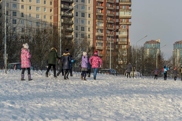 Physical education lesson in the park on the banks of the Neva.