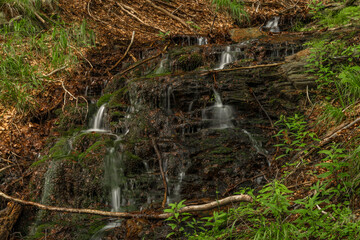 Waterfall near Kouty nad Desnou village in summer day