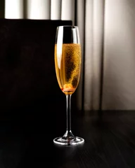Foto op Aluminium Glasses with champagne on a table in a restaurant © Jan
