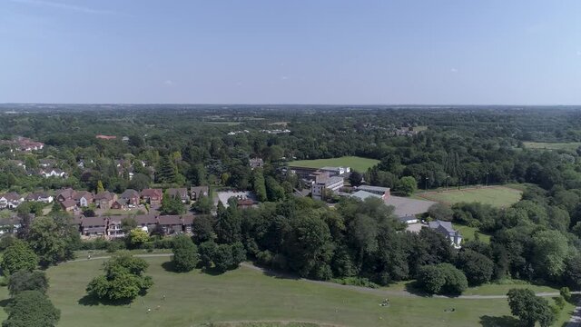 Left to right aerial shot above park in Solihull, Birmingham, UK