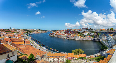 Fototapeta na wymiar Panoramic view of the old city center of Porto (Oporto), Portugal with the famous Luis I Bridge and the Douro River.
