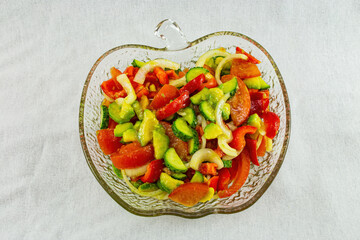 Salad with vegetables with avocado on a white background
