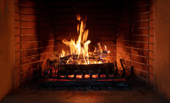Fireplace, fire burning, cozy warm fireside, christmas home.
