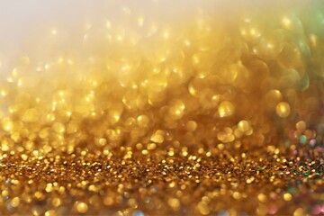  gold glitter glow background.  gold shiny texture.New Year and Christmas background.Wallpaper...