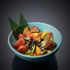 Japanese salad on a gray-black background.
