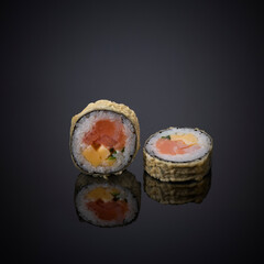 Japanese sushi on a gray-black background.
