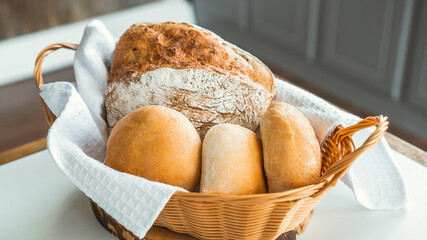 A basket containing fresh crisp bread.
