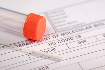 SARS COV-2 (covid-19) antigen detection test, transport vial with orange closure and swab, on health medical report