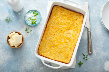 Cheesy cornbread freshly baked in a pan, southern food