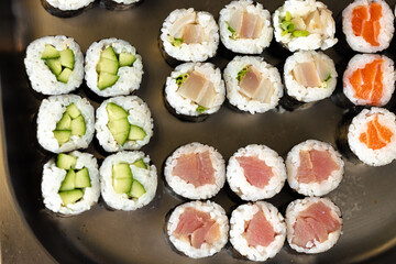Set of maki sushi on metal tray