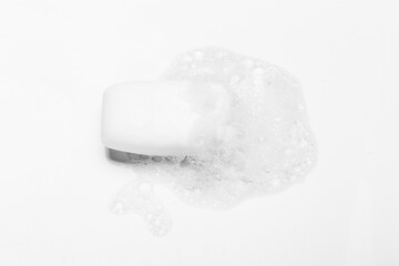 Soap bar and foam on white background, top view. Mockup for design