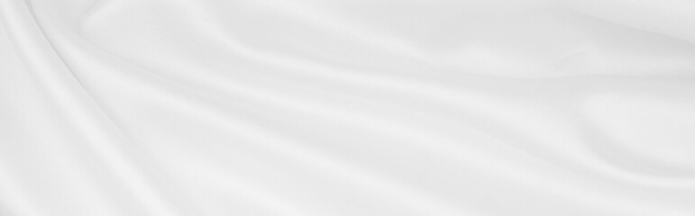 Obraz premium Smooth elegant white silk or satin luxury cloth texture as wedding background. Luxurious background design
