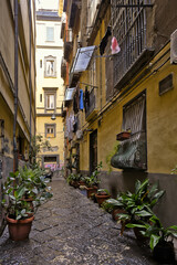 Naples, Italy, December 10, 2020. An old street in the historic city center on a winter day.