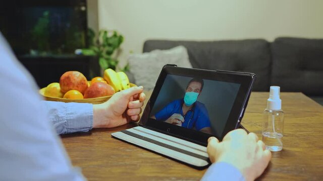Man making video call with his doctor.