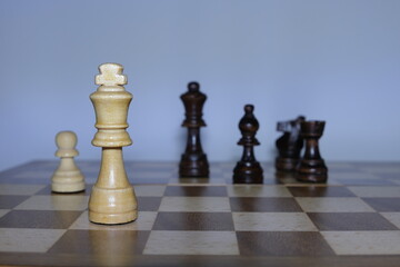 Checkmate concept. Chess board game concept background. Wood chess pieces on board game. Selective focus area. 