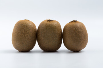 Green kiwi on white background © Veronica Glez