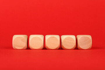 Blank wooden cube signs over red background