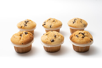 muffins with chocolate chips on a white background. Space to insert text