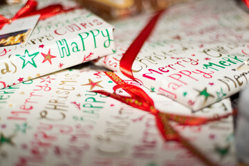 Christmas presents in colorful wrapping paper in close-up.