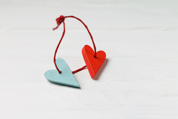 Two wooden hearts tied with a red rope. Love. Valentine's Day.