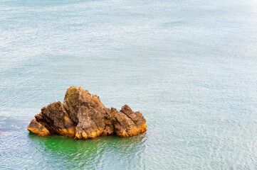 Coastal geological feature surrounded by water
