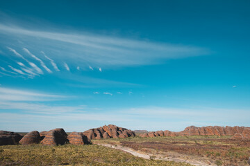 a landscape with rocks and a road
