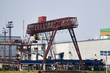 Fototapeta na wymiar industrial landscape with an overhead crane in a factory yard