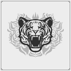 The emblem with tiger for a sport team. Print design for t-shirt.