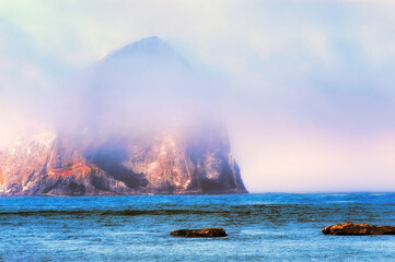 Fog surrounds Haystack Rock in Pacific City