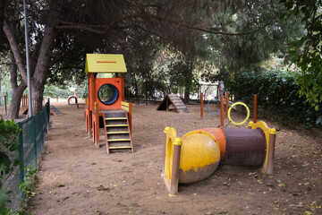 Colorful and dirty dog training area in the city park
