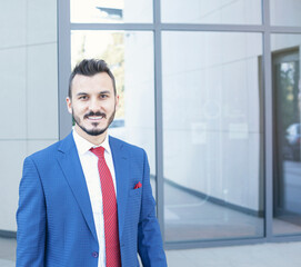 Handsome businessman portrait in outdoors.