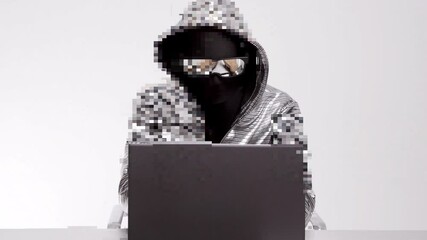 Computer hacker in silver jacket