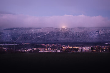 a city with a mountain in the background