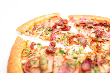 Pizza with hunting sausages, blue onions, ham and herbs isolated on white background