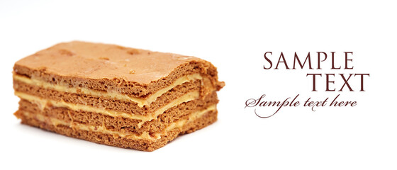 close-up of a piece of honey cake on a white isolated background