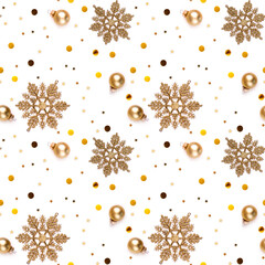 Seamless white New Year's Eve background with gold snowflakes, decorative balls, shining stars and...