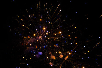 Colorful Fireworks Emitting Sparks - Fireworks at Night with Dark Background. New Years Eve Celebration. Particle Effect, Glowing, Blazing, Twinkling, Glistening.