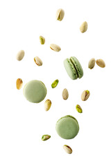 Flying green sweet pistachio macarons and nuts isolated