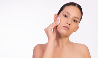 Girl with cosmetic pad , cleaning sink and removing make up, isolated on white, with copy space