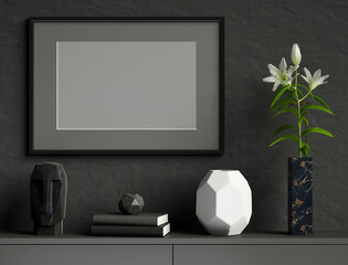 Black mock up poster frame on dark plaster wall with lily flower in marble vase, books, geometric pots, head sculpture; landscape orientation; stylish frame mock up; 3d rendering, 3d illustration	