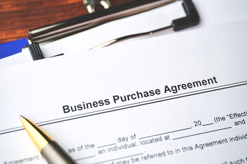 Legal document Business Purchase Agreement on paper close up