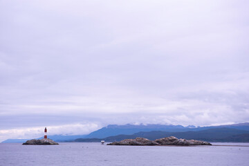 Fototapeta premium boats in the sea whit lighthouse