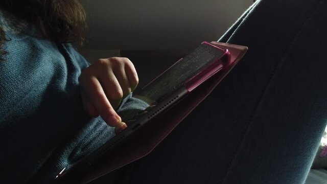 Girl playing on a tablet