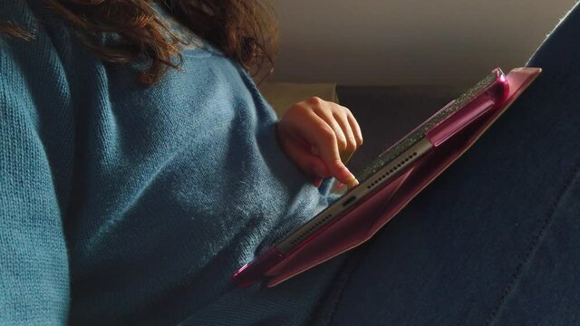 Girl playing on a tablet