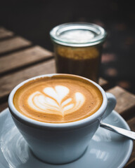 cup of cappuccino with beautiful barista coffee art