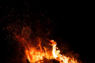 Fototapeta na wymiar Fire flames on black background. fire burst texture for banner backdrop.