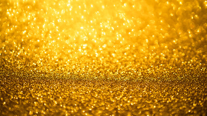 Golden blur abstract background. Yellow Bokeh Christmas blurred beautiful shiny Christmas lights.